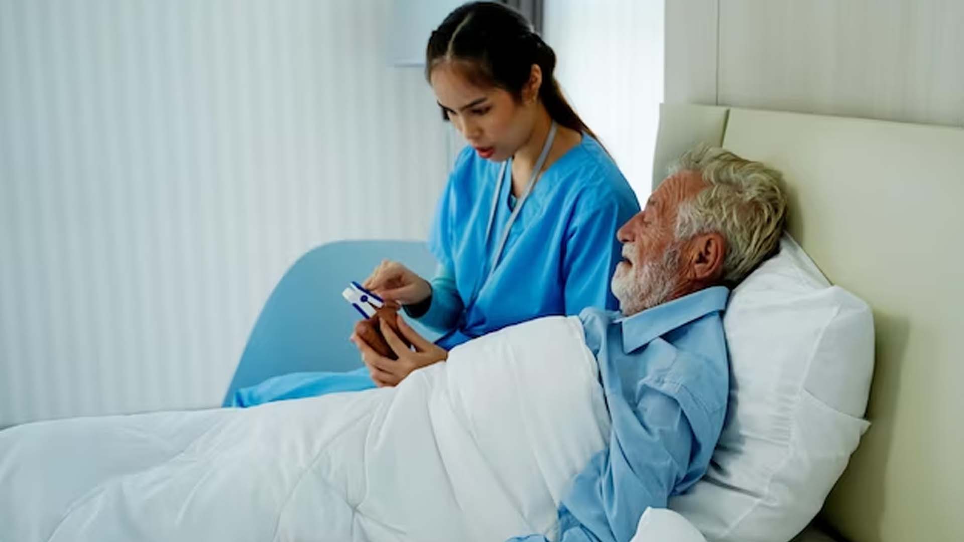 Nurse uses a heart rate monitor elderly patient check the heartbeat check