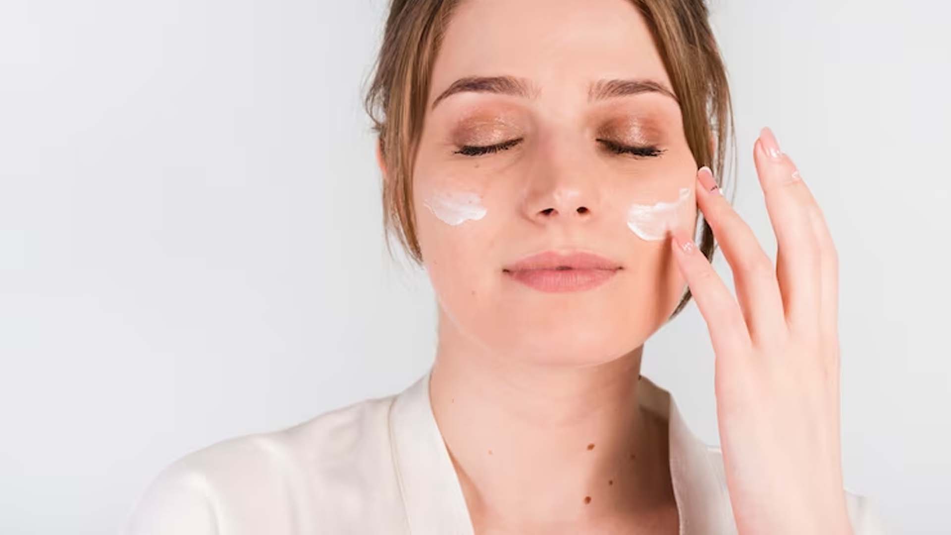Applying Curd or yogurt on Face