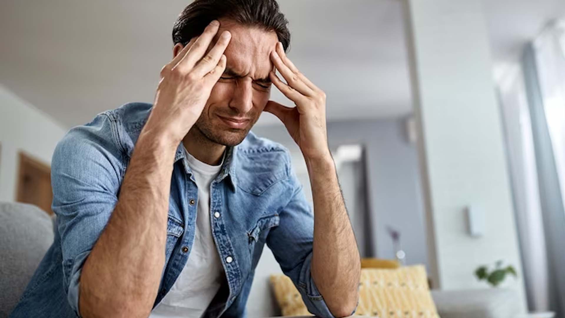 Man holding his head