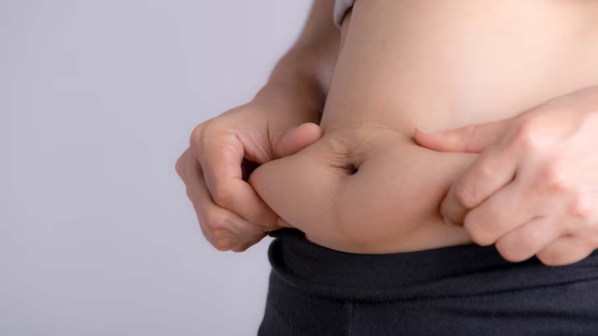 Women Showing her Belly Fat
