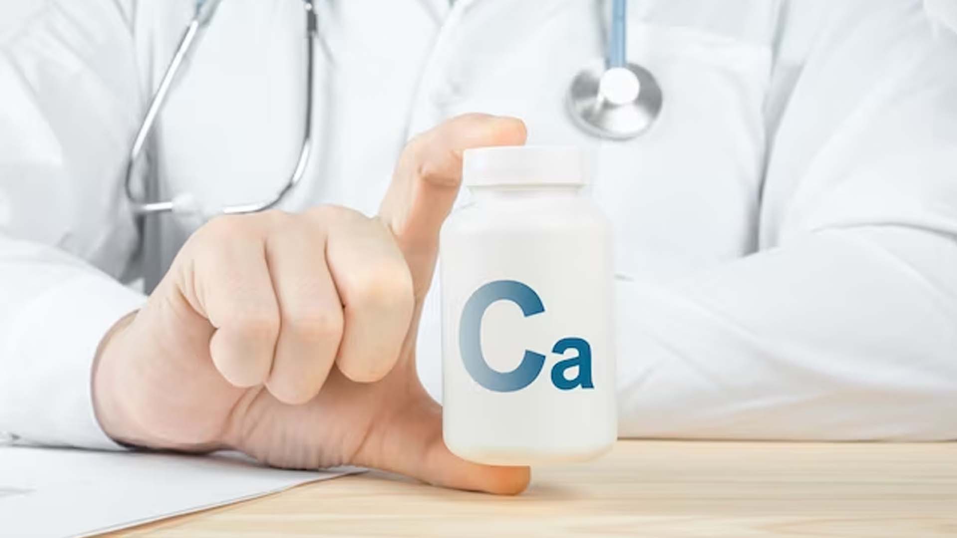 Doctor Holding Calcium Supplements