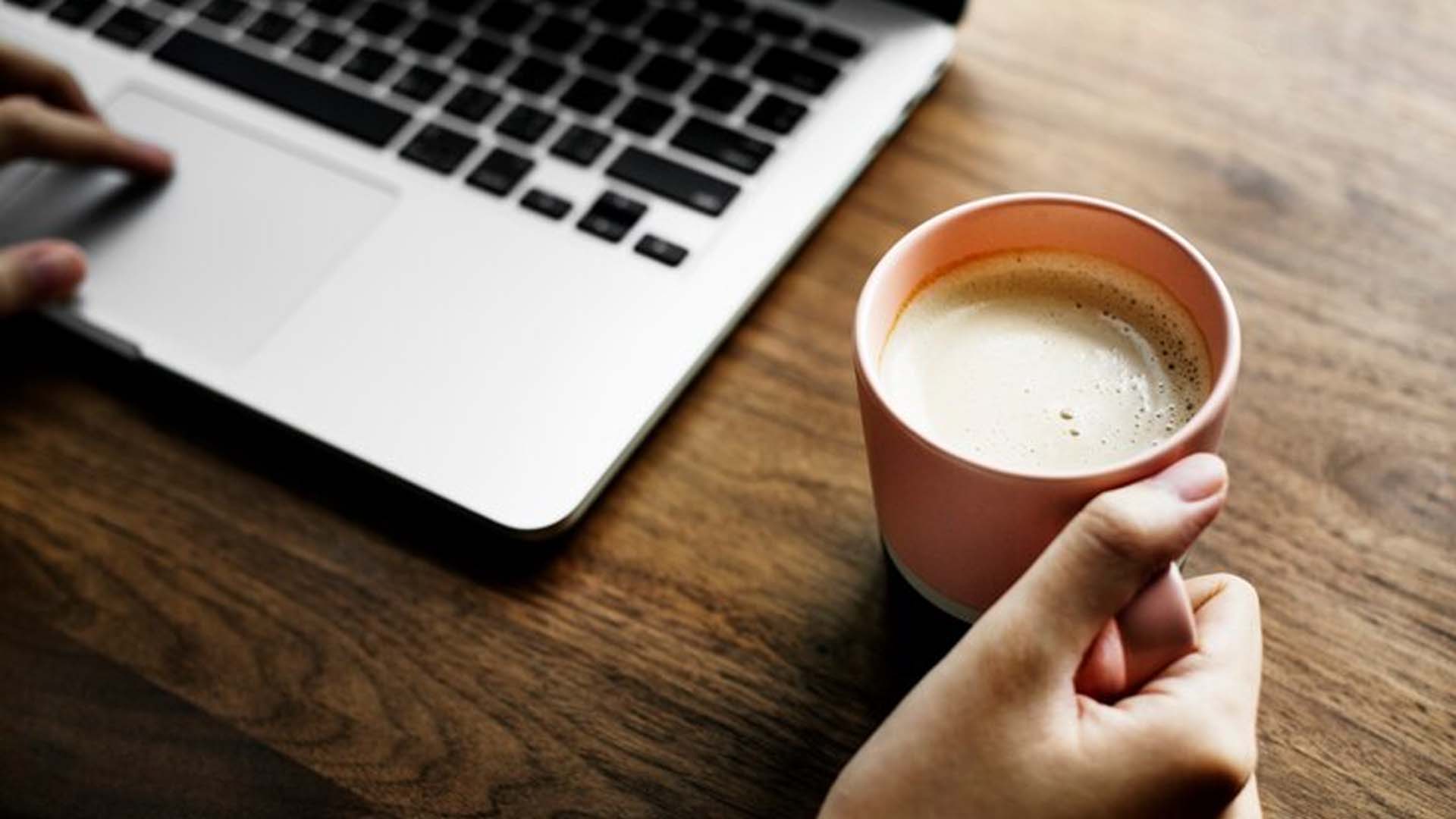 Women Holding Coffee Cup