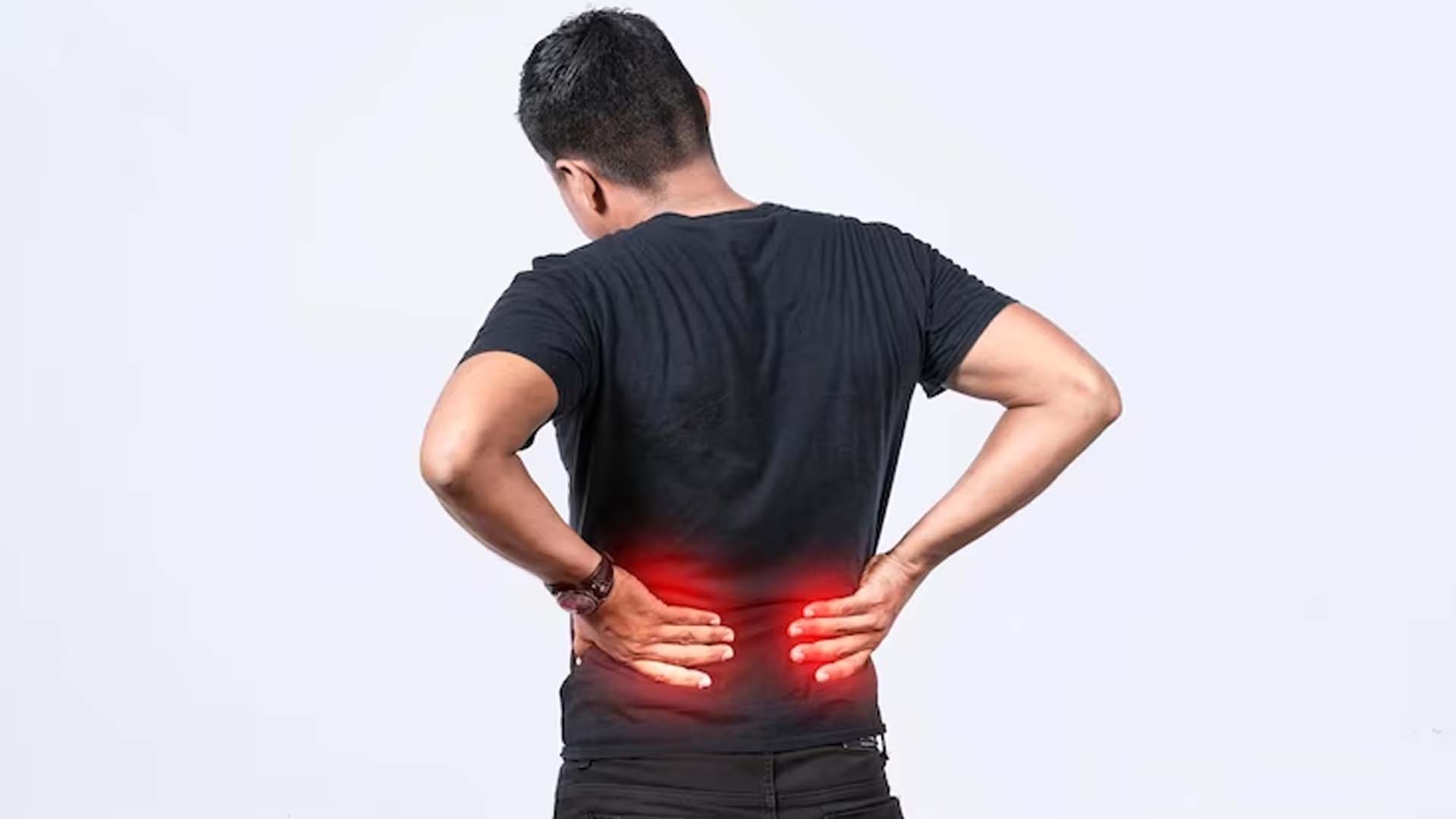 Man Holding His Back with Pain