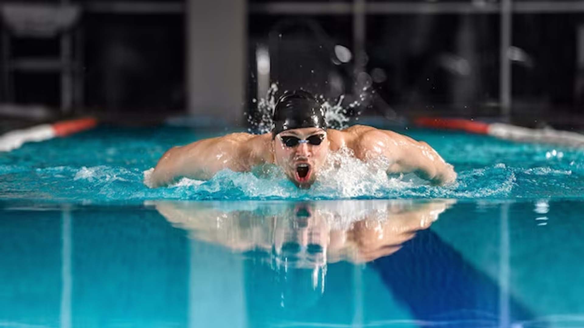 male swimmer swimming the butterfly stroke