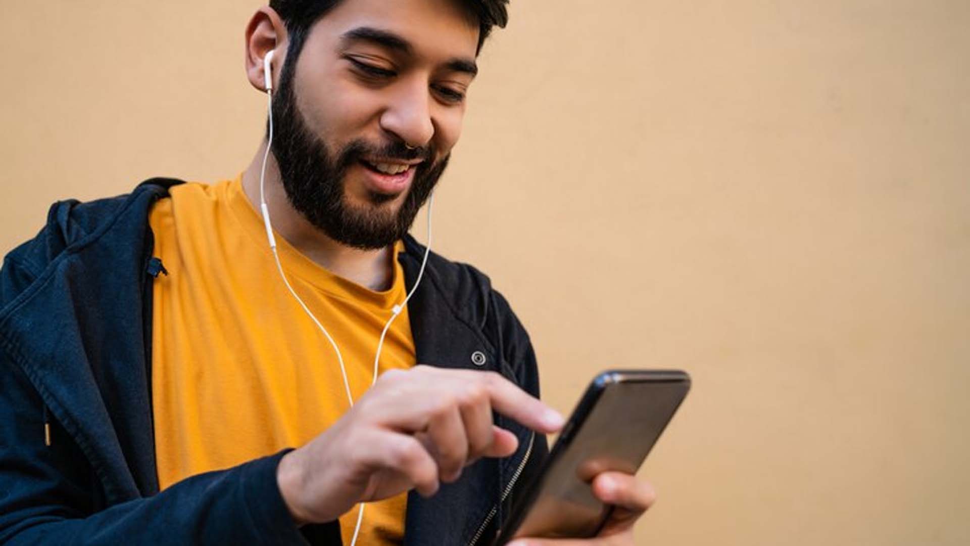 Man using Phones with earphones