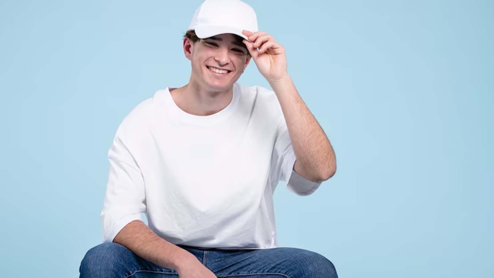 Man in White T-shirt Wearing Cap