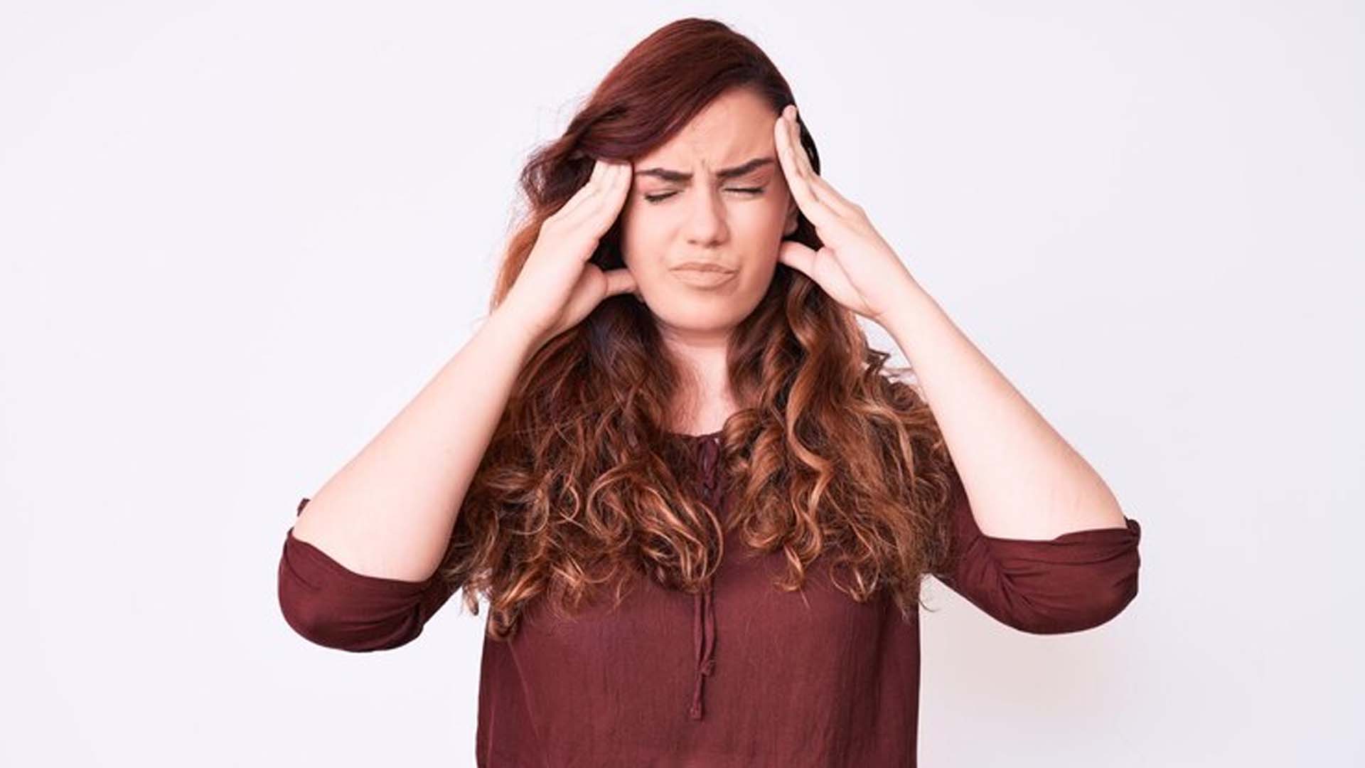 Women Holding Head with Headache