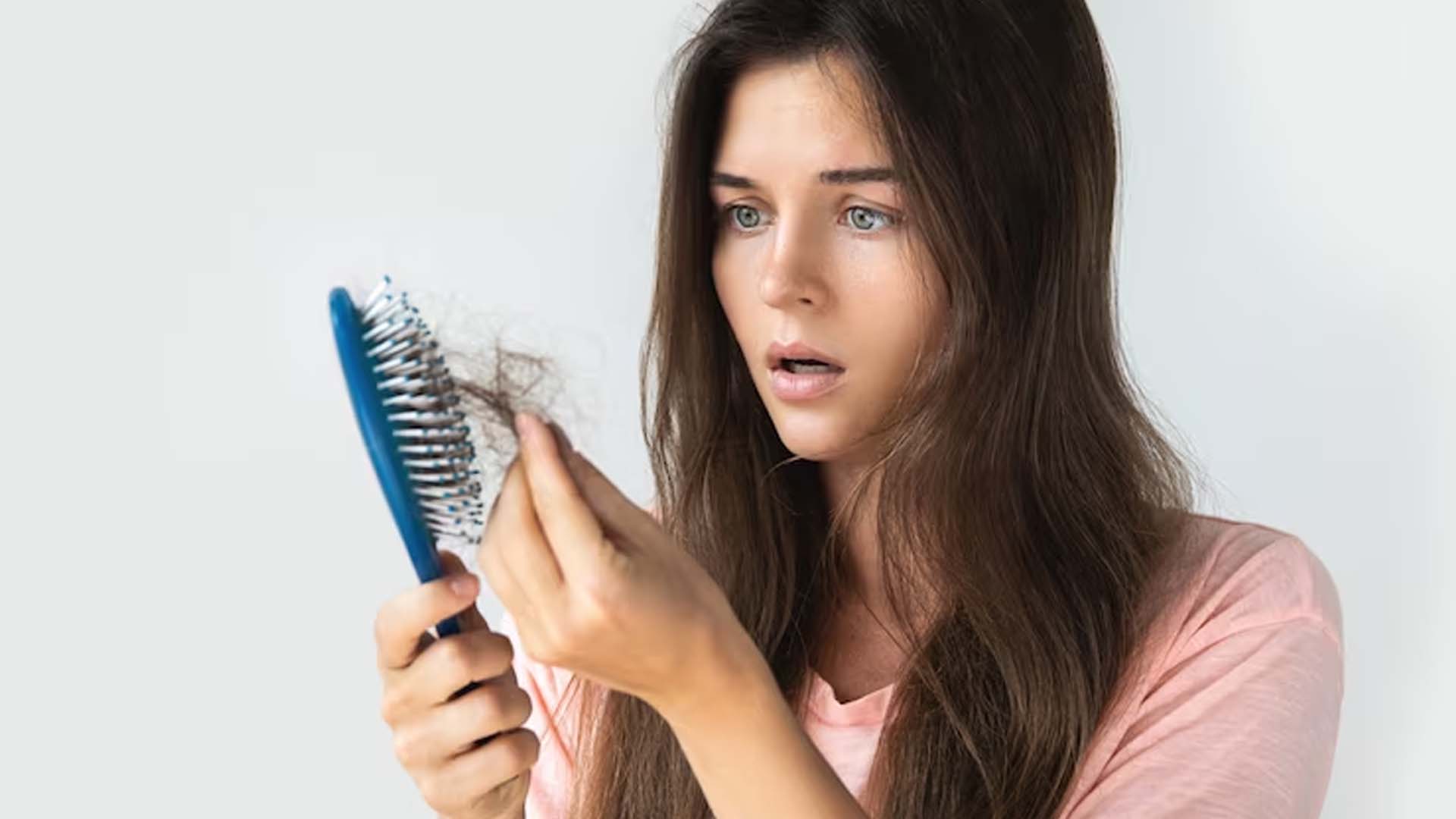 shocked Women Looking at Hair fall