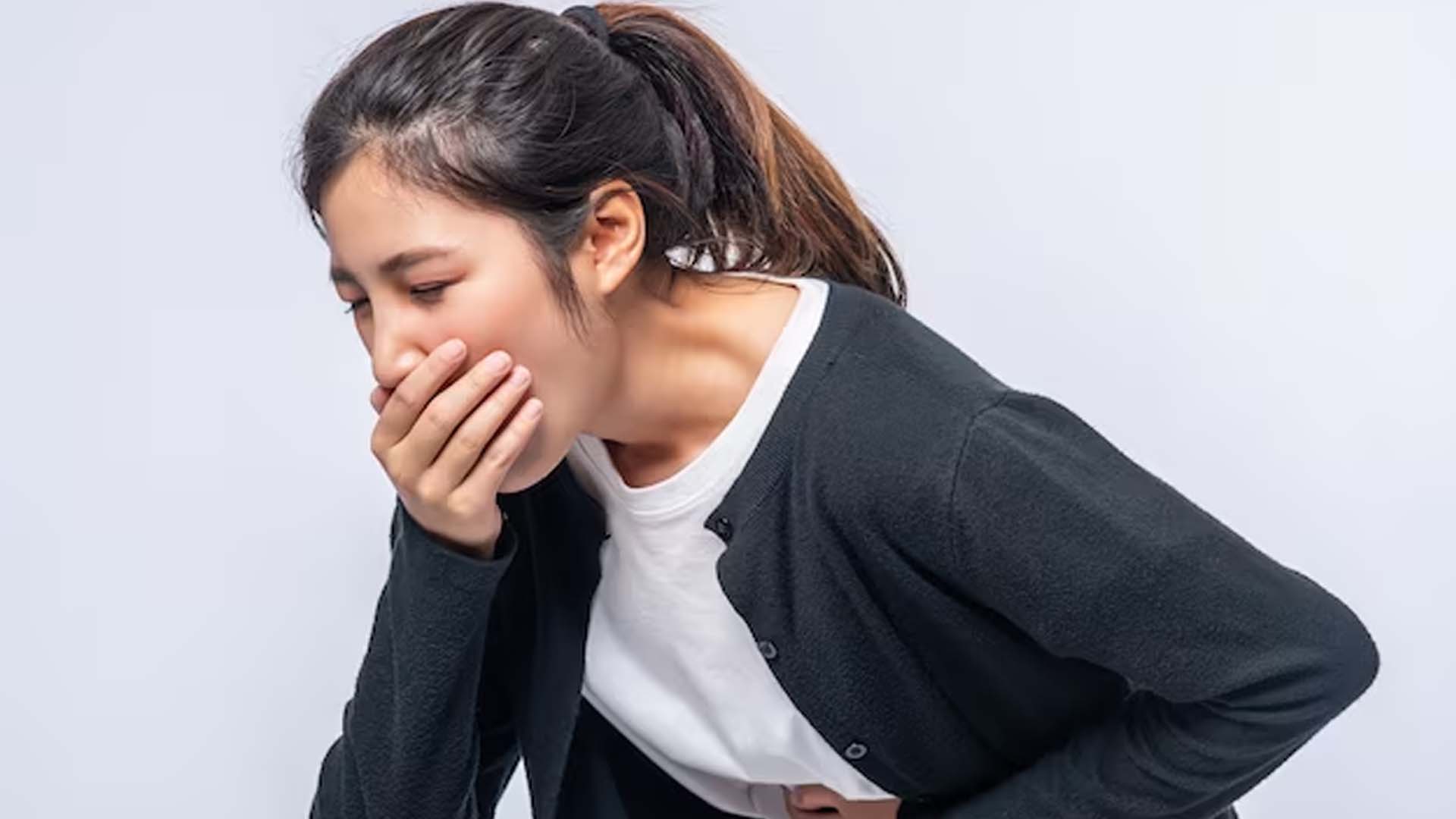 Vomiting Women Holding Her Mouth