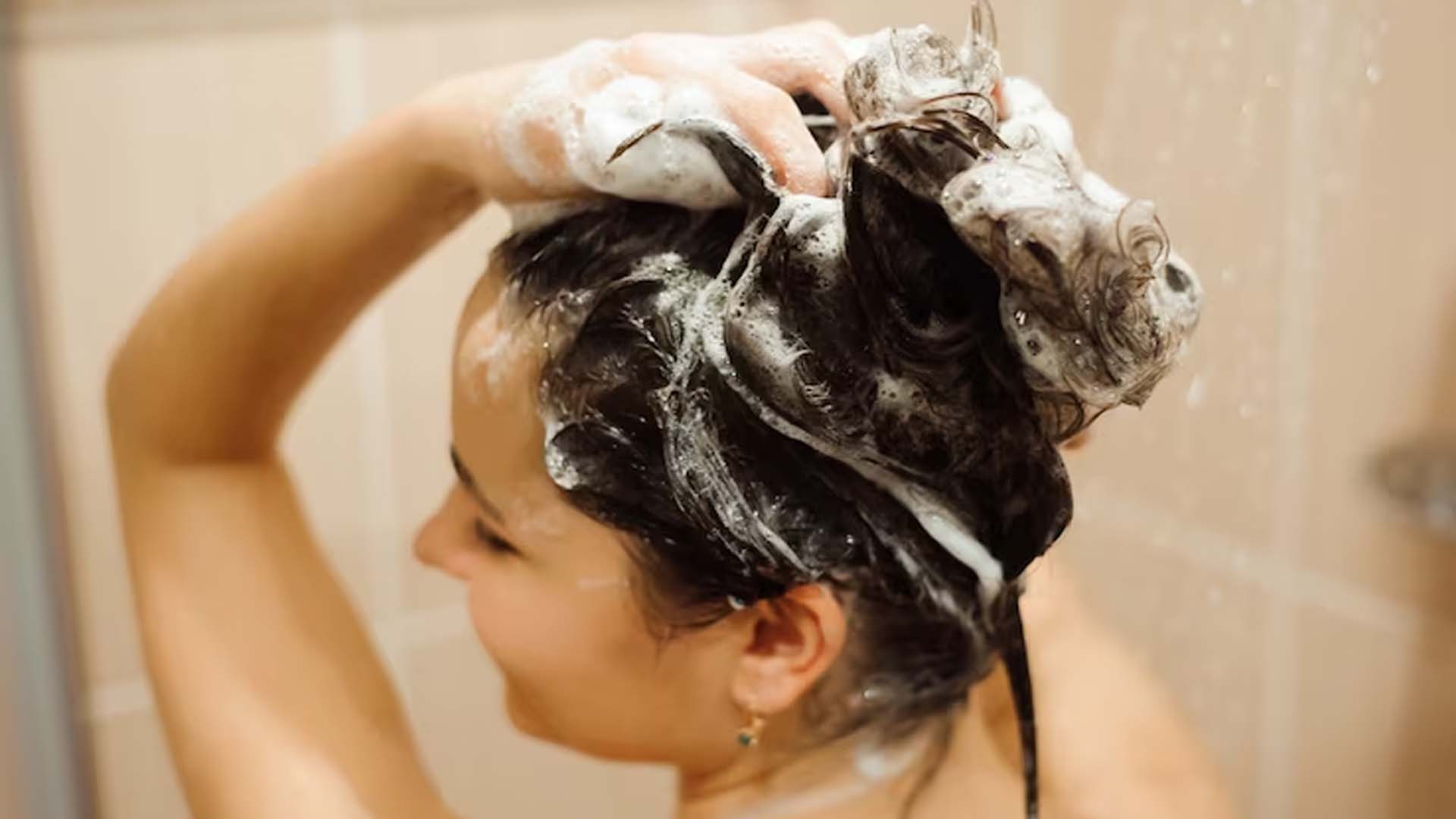 Women Washing Hair with shampoo