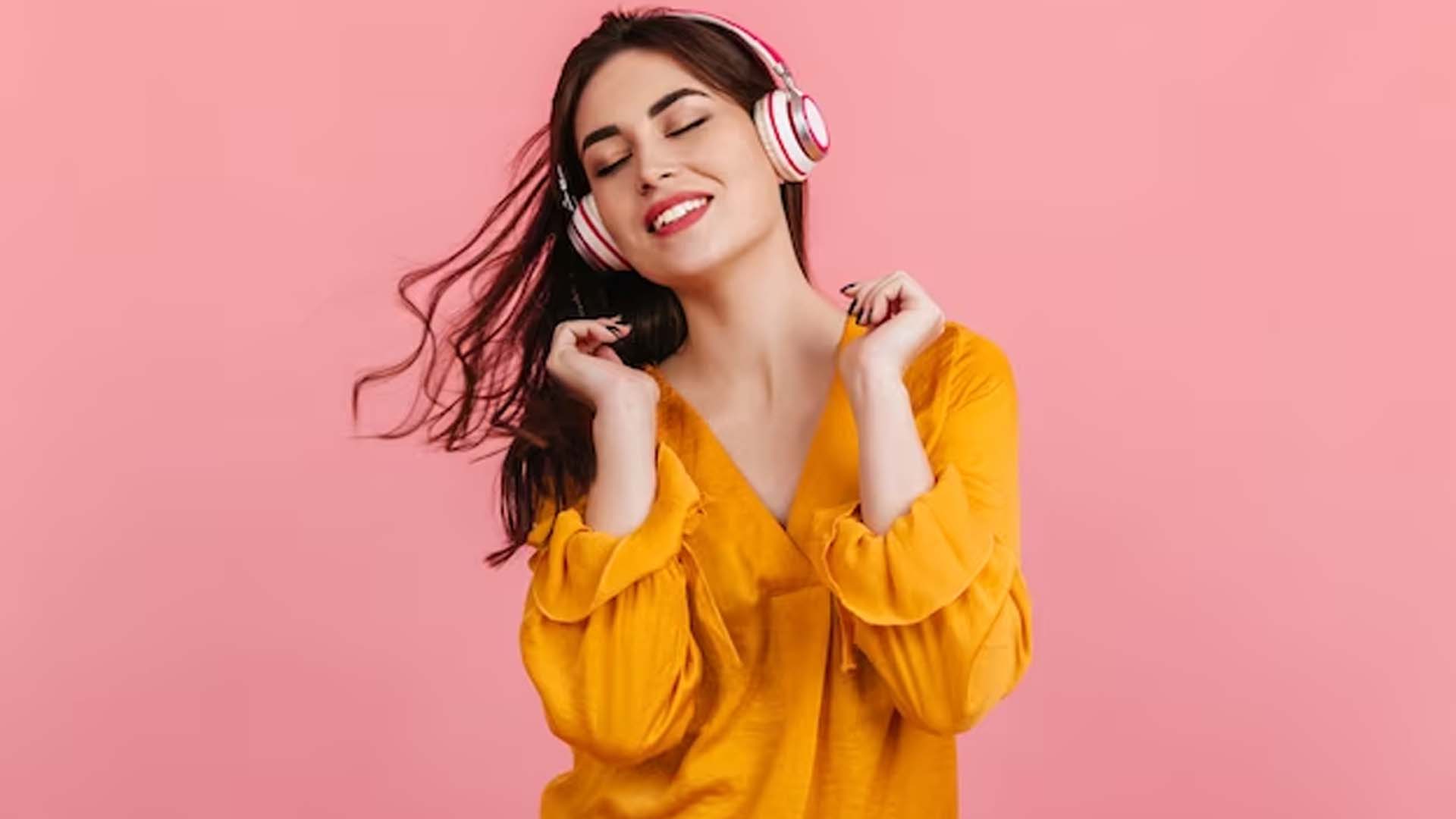 Women Wearing Headphones and Enjoying the Music