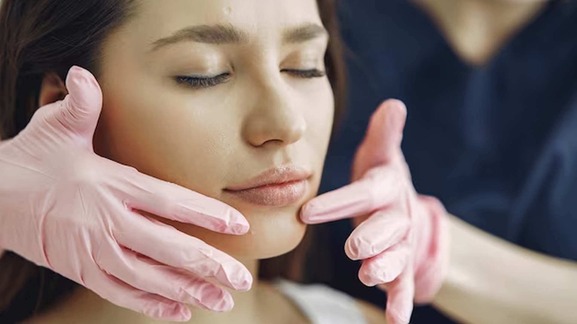 Doctor Examining Chin for Implant