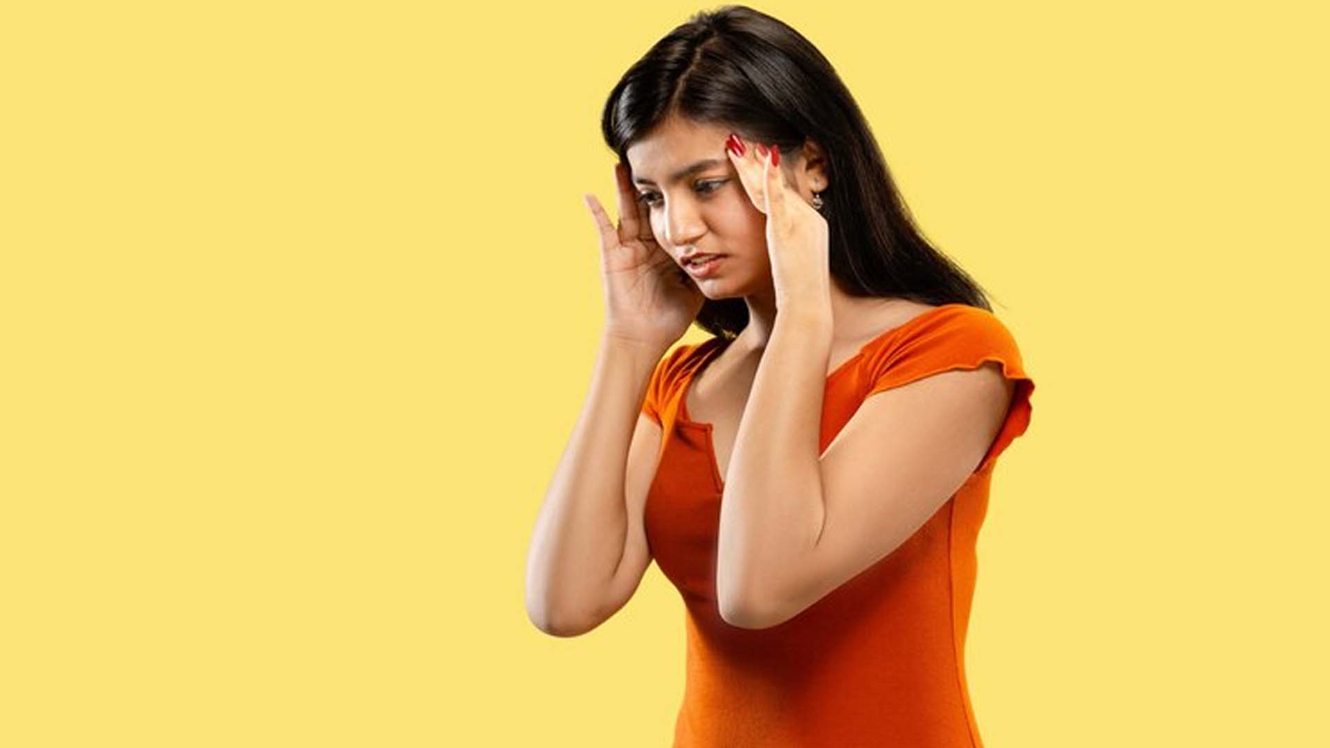 Women holding Head with Headache