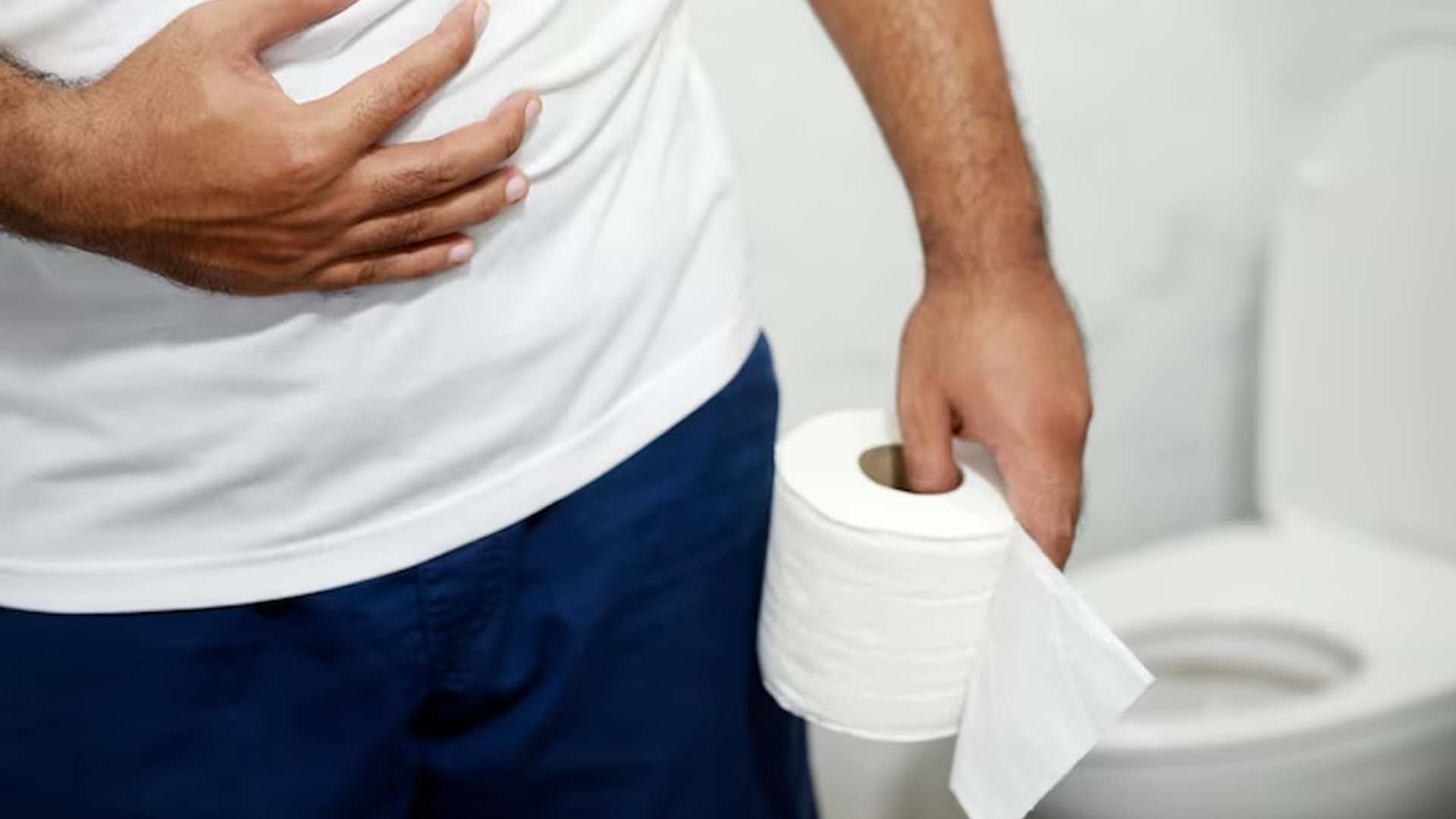 Man suffering from Diarrhea holding tissue in hands