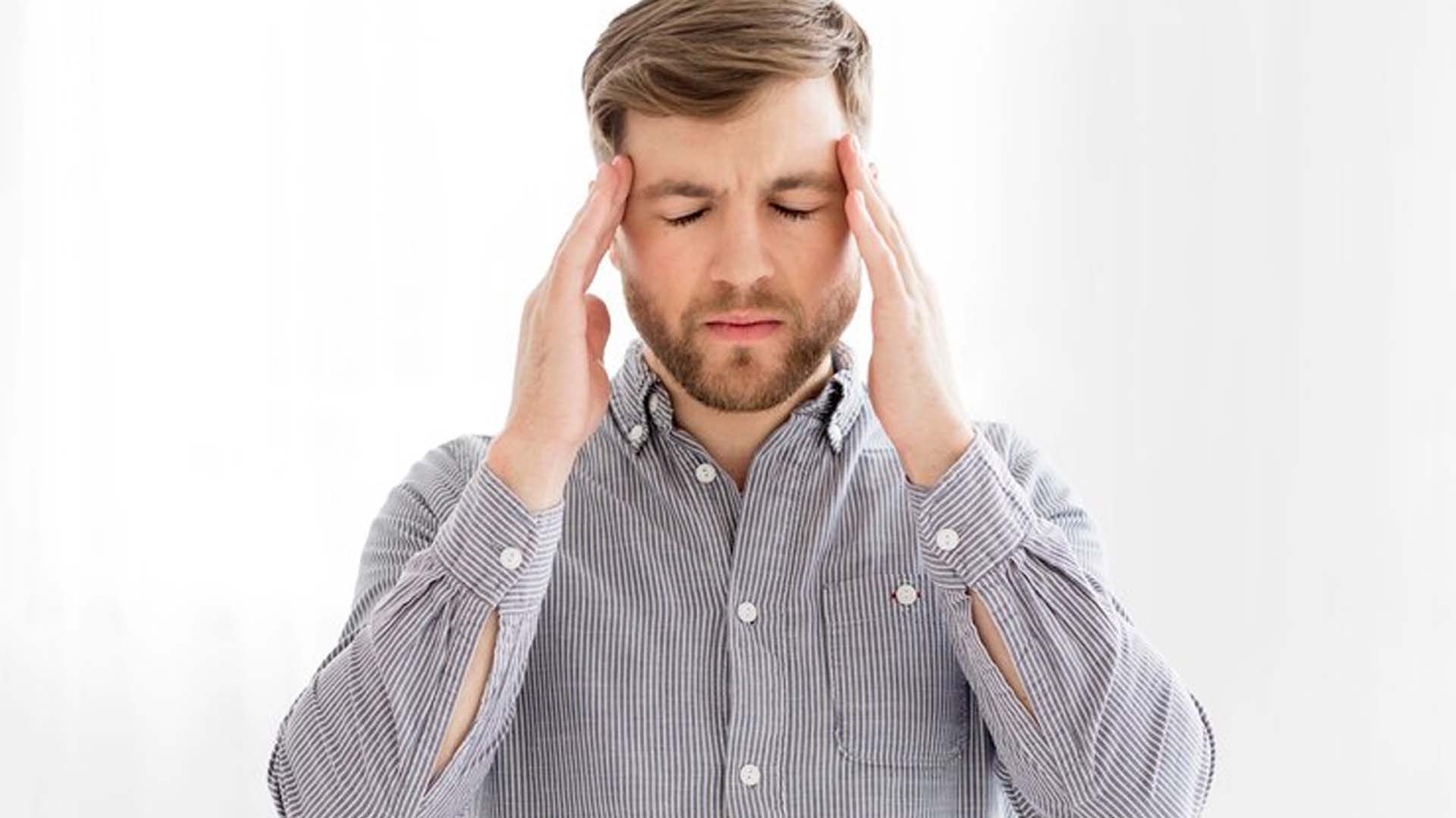 Man Holding Head with Headache or Pain