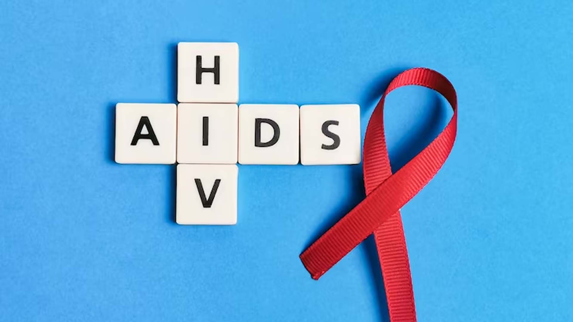 Red ribbon with crosswords Aids and HIV
