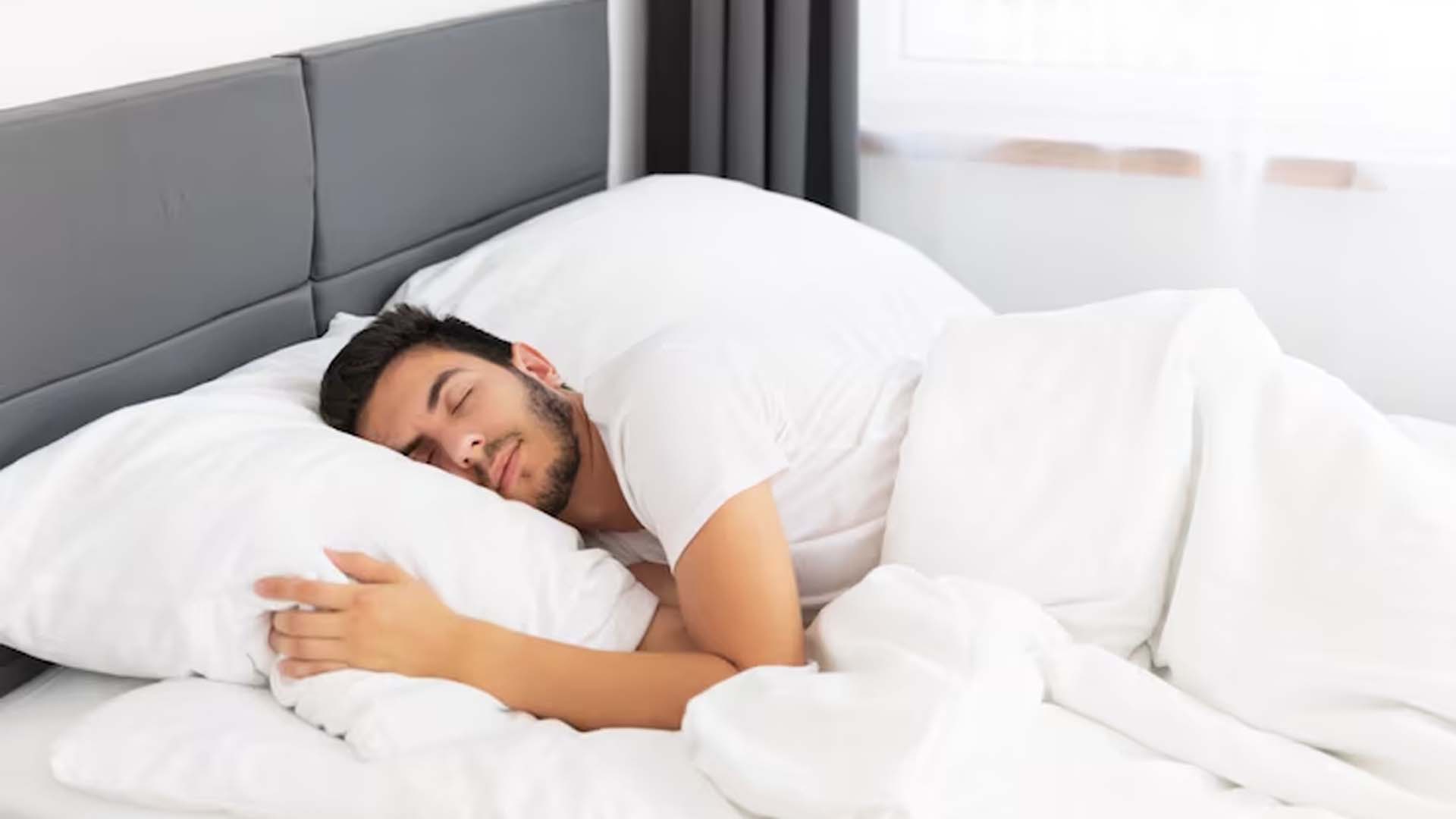 Man Sleeping on Bed