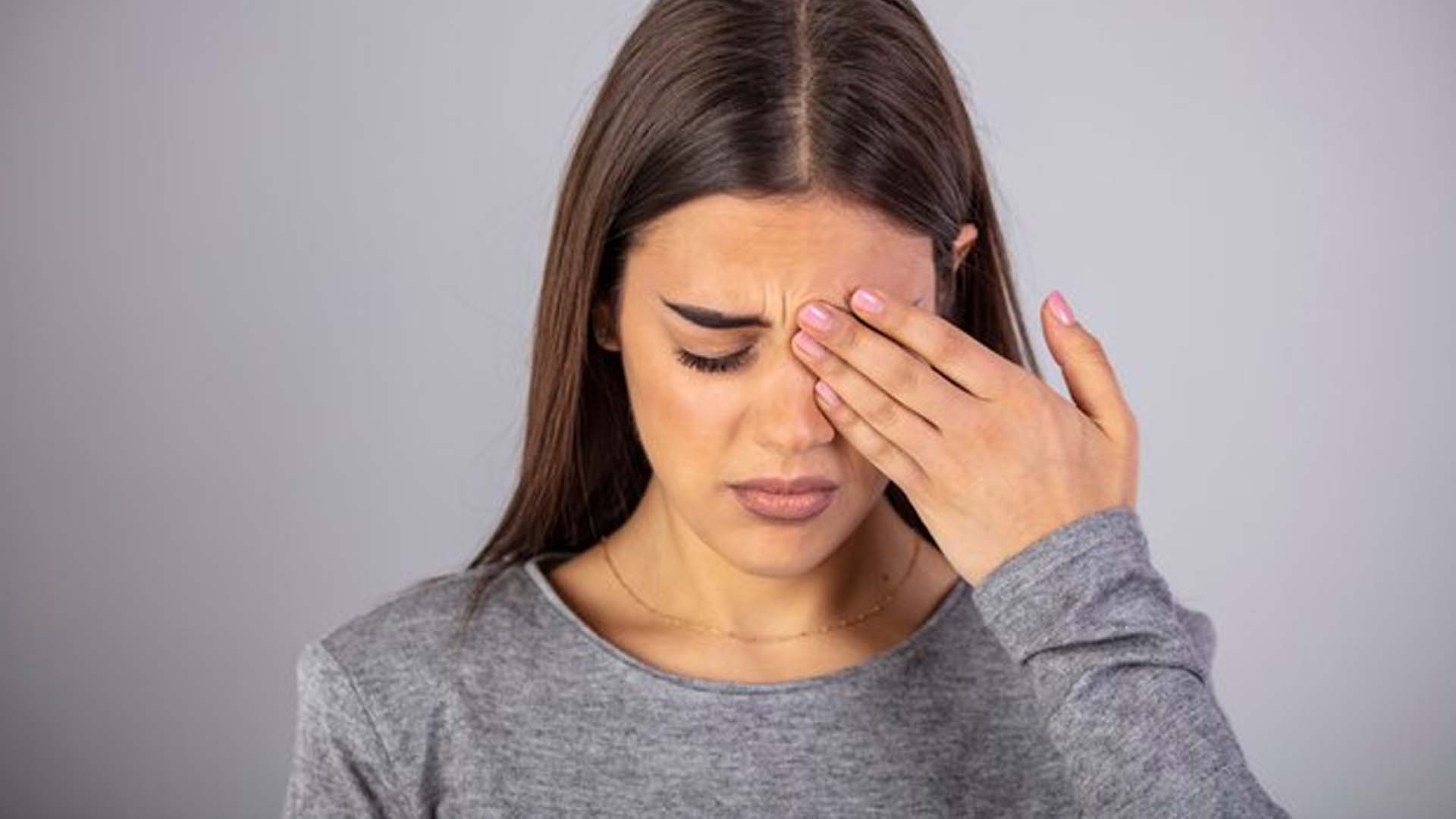 Women Suffering from pain or discomfort of eye