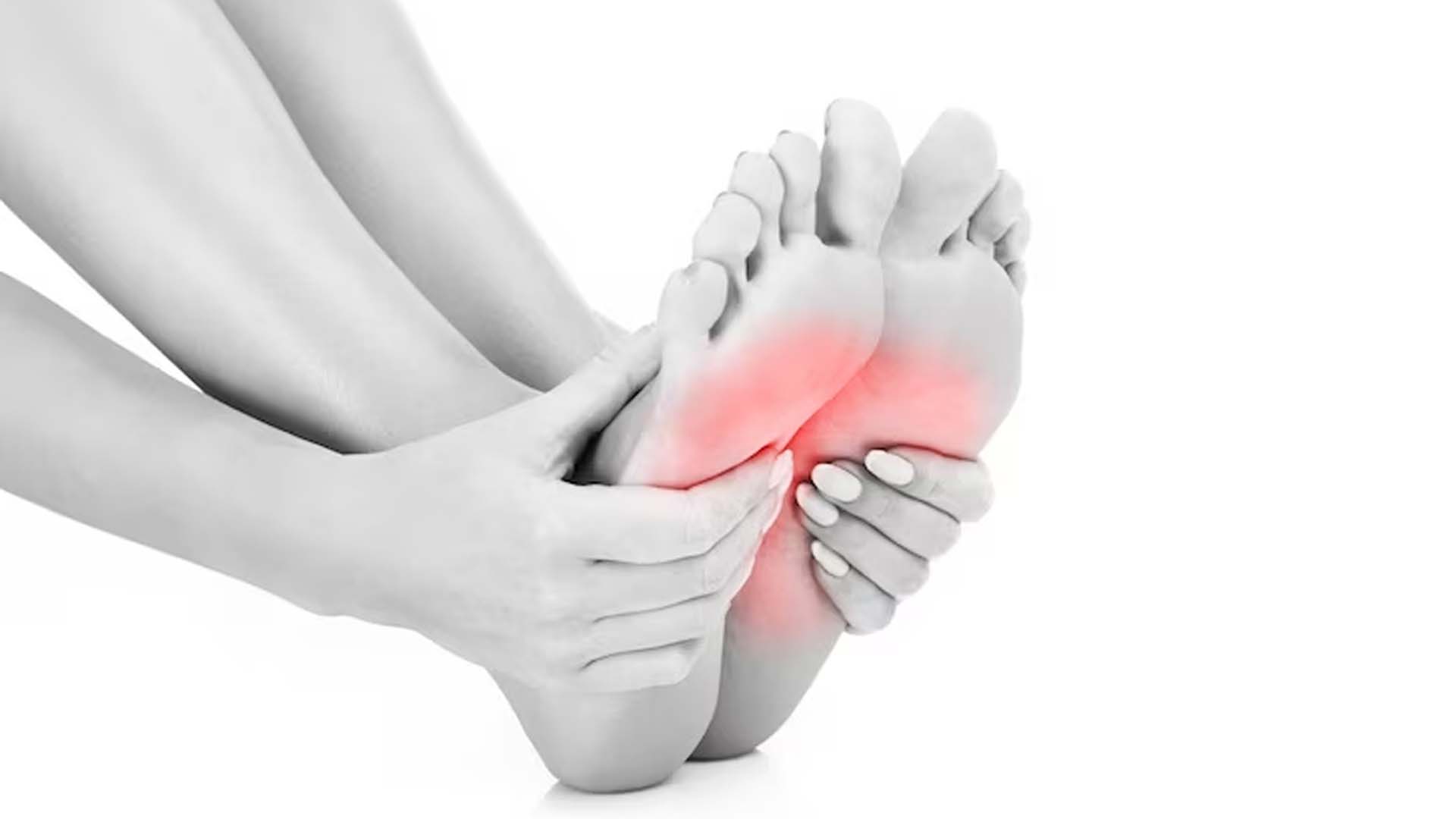 women Holding Feet with Cramps or pain