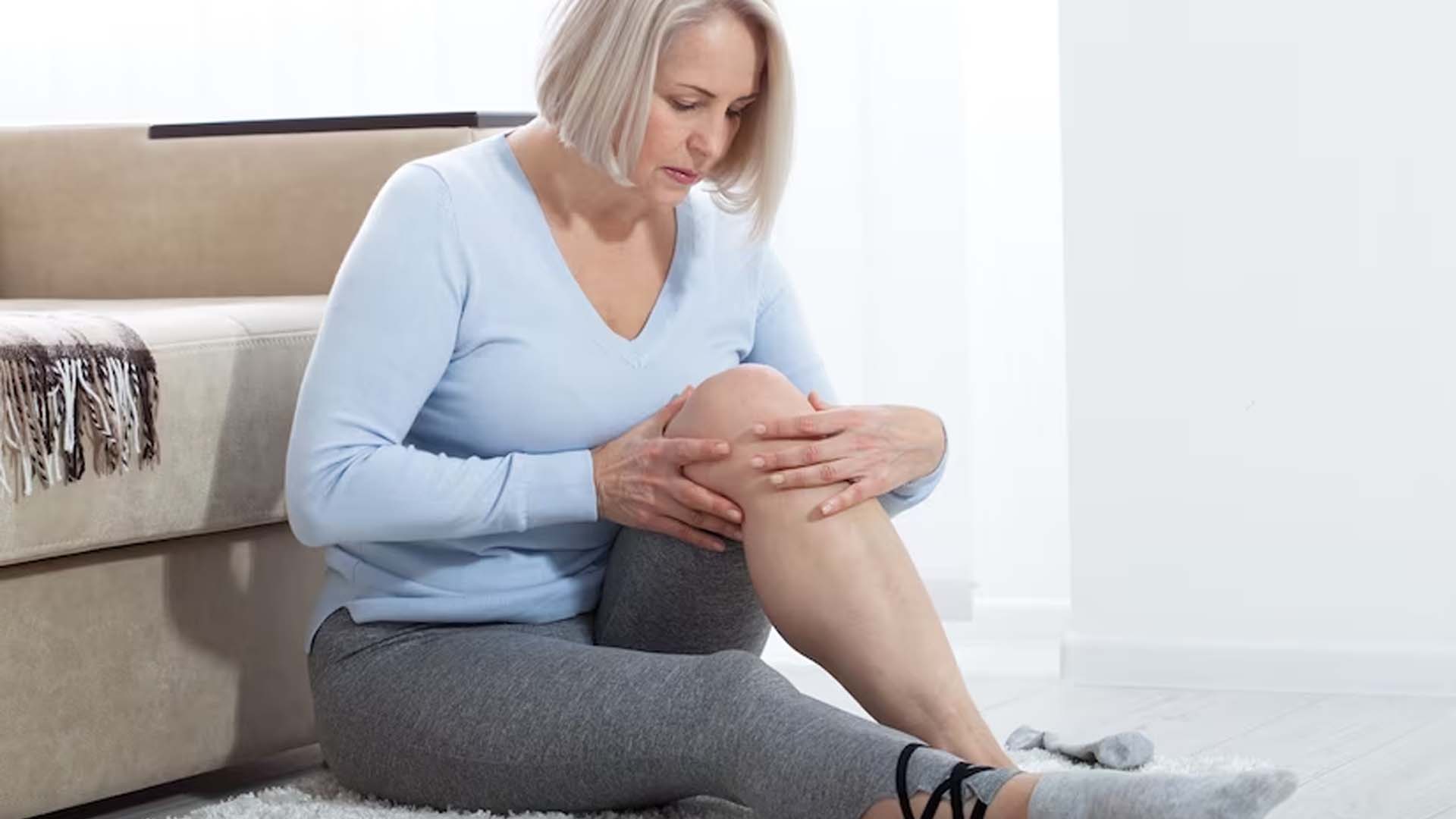 Women massaging her Legs with Pain