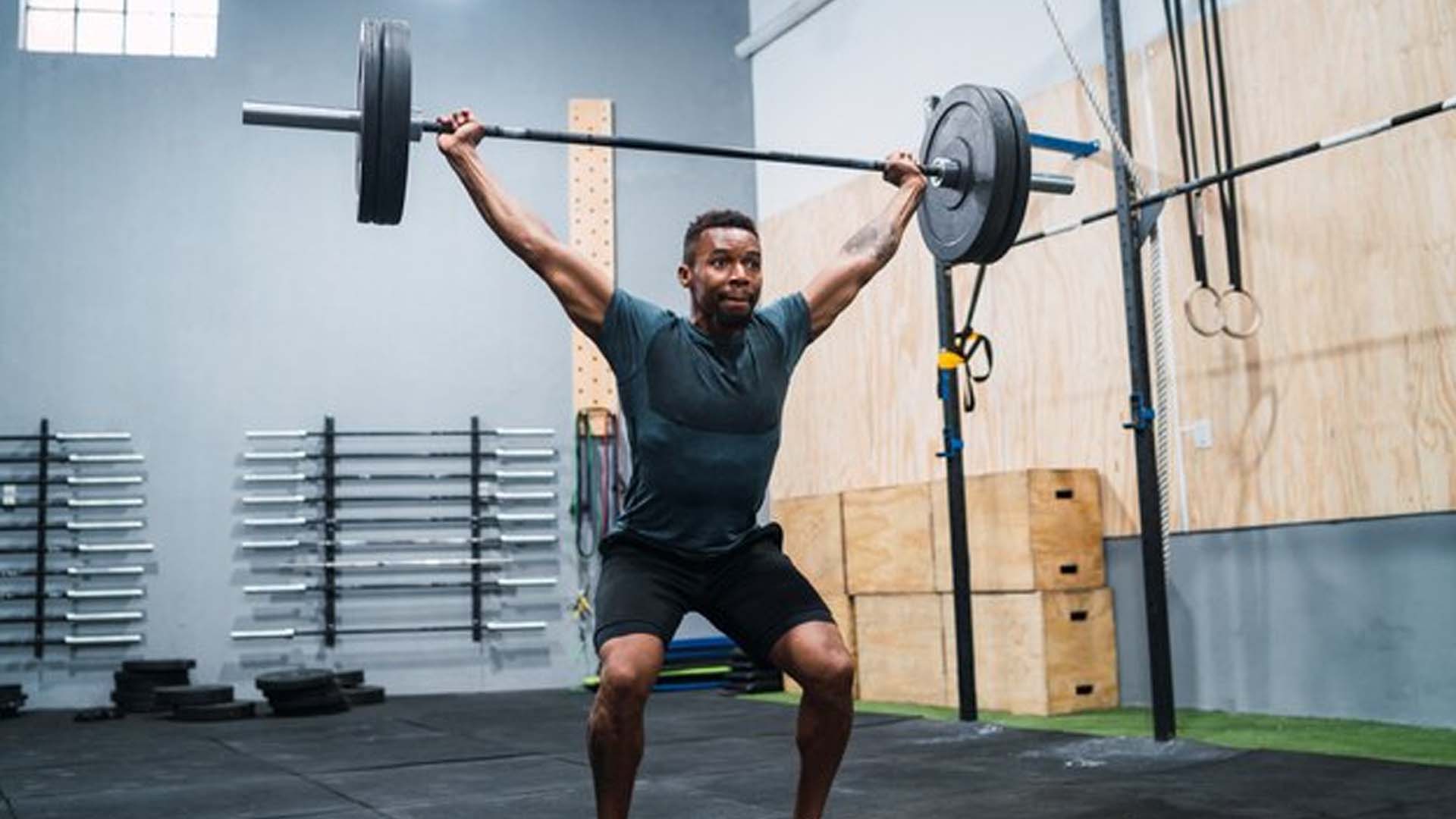 Man Lifting Heavy Weights in gym