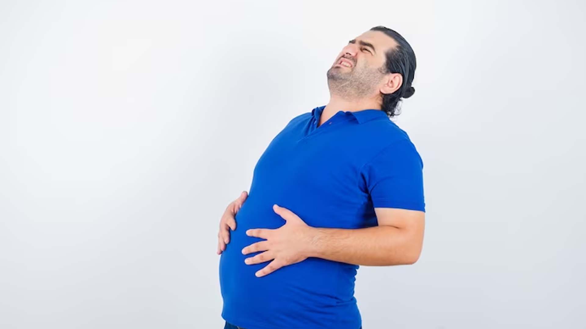 Man holding stomach with Gas and Bloating