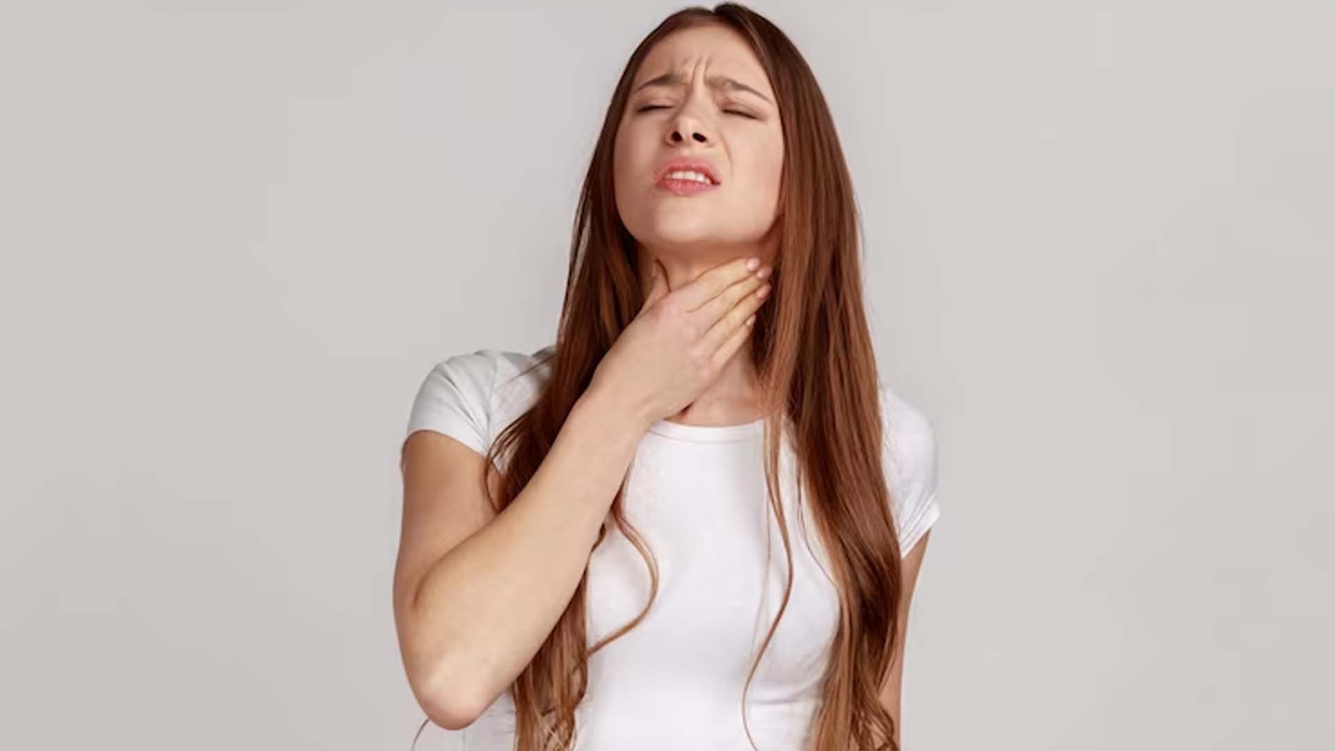 Women suffering from Throat Pain