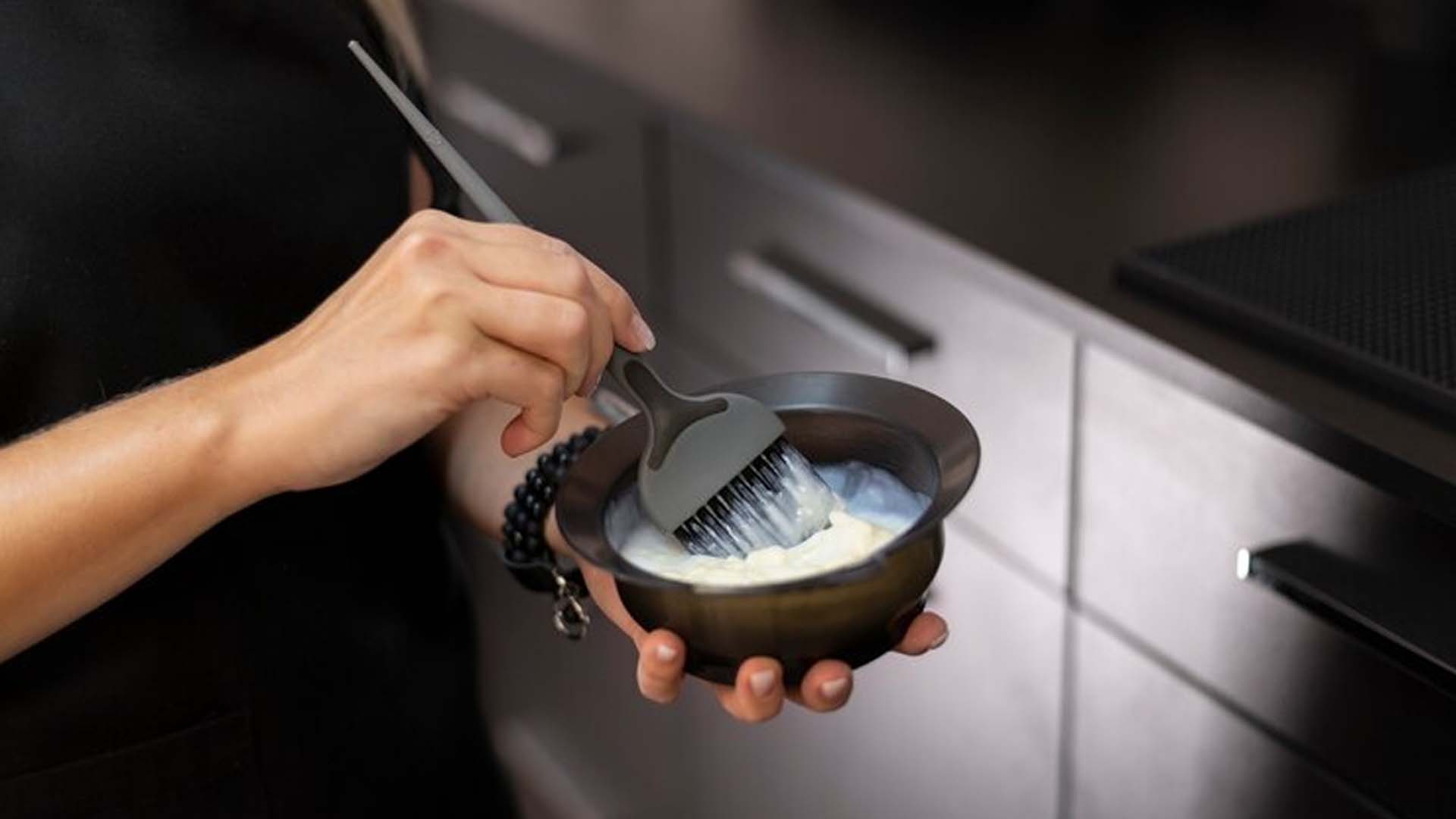 Mixing hair dye in a bowl