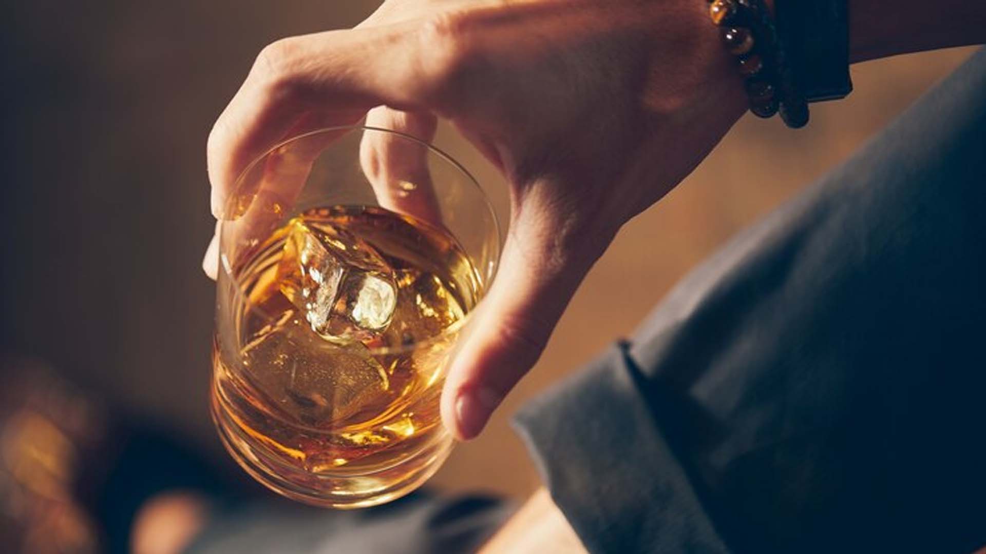 Holding Alcohol glass