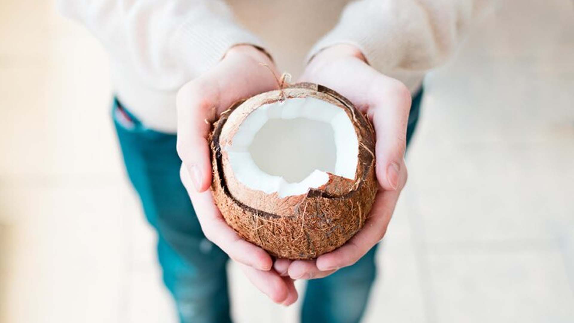 Women holding Coconut