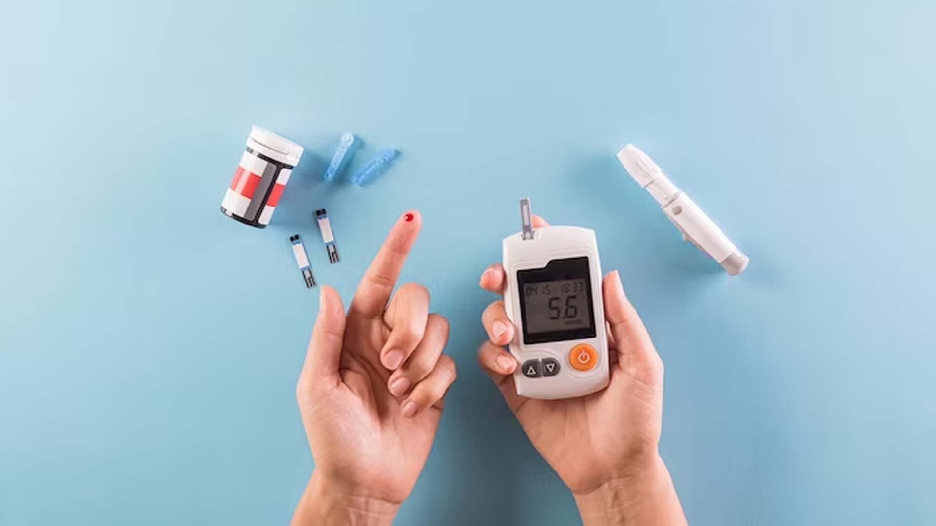 Person checking Diabetes in monitor