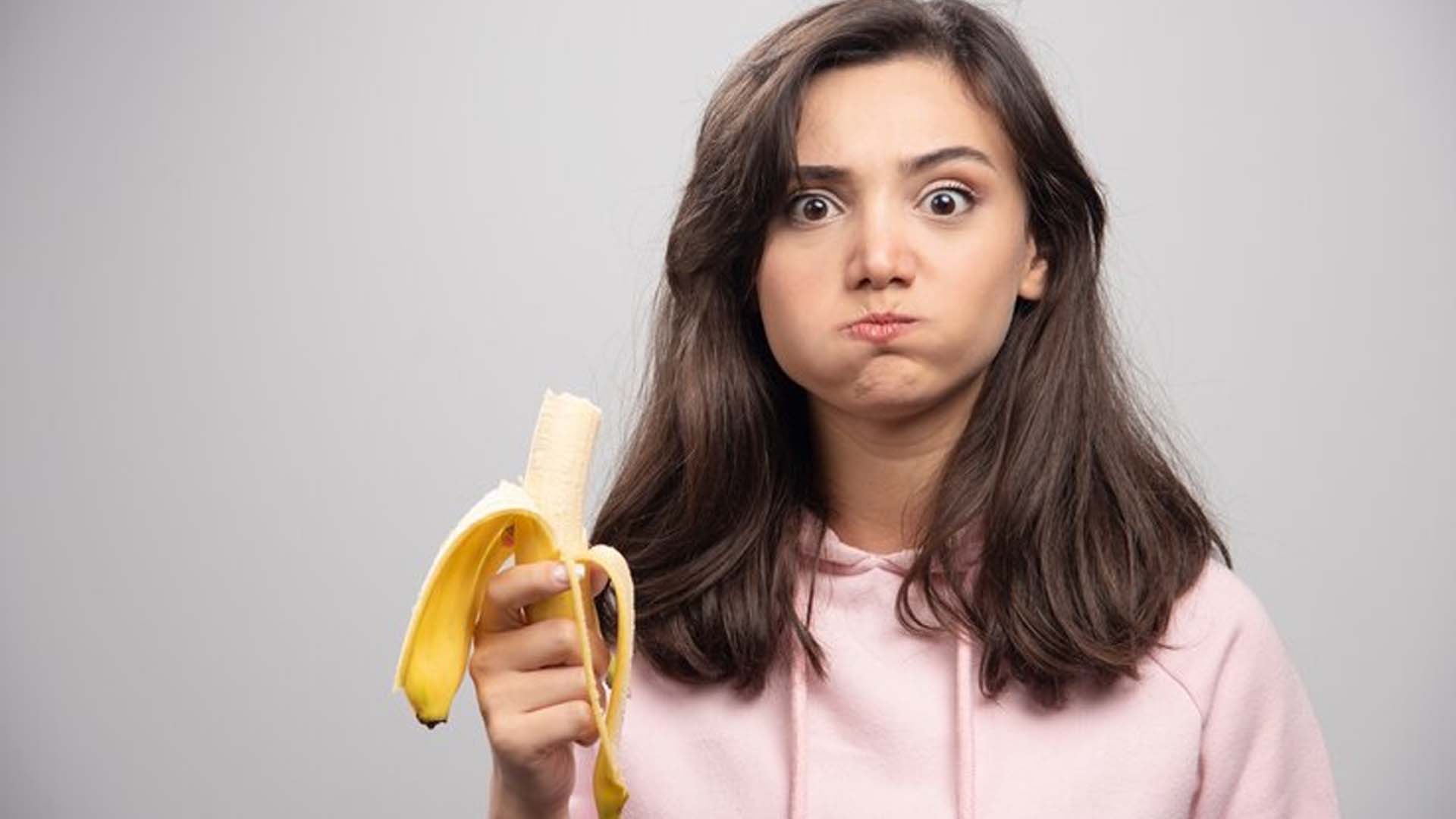 Girl eating Banana
