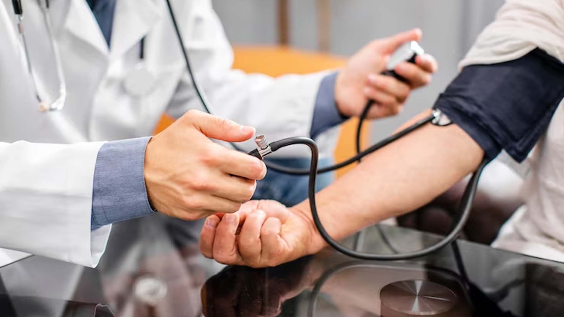 Doctor Checking Blood Pressure