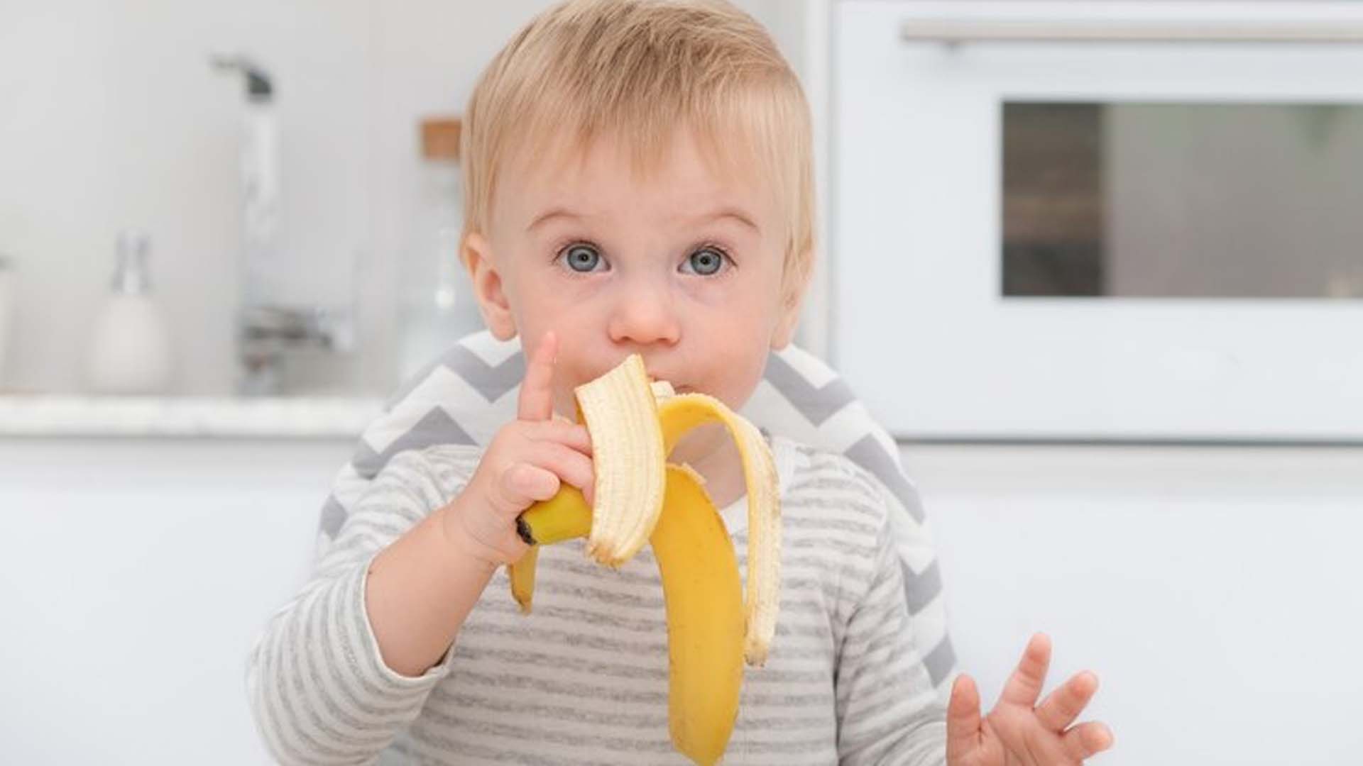 Baby eating Banana