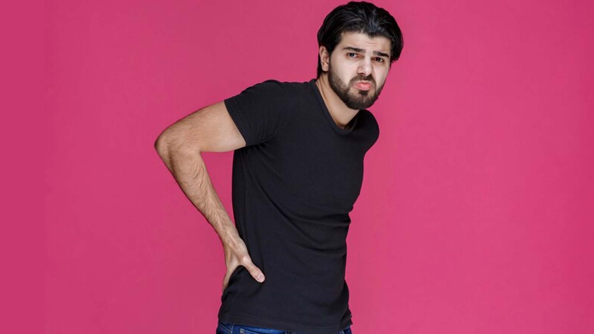 Man holding his waist with Backpain